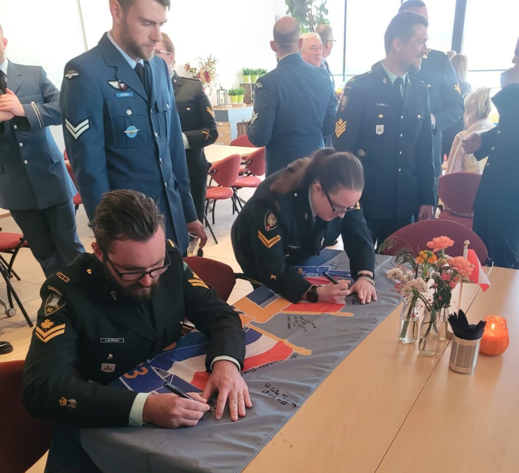 Signing the Flag that we will leave for our Dutch Colleagues