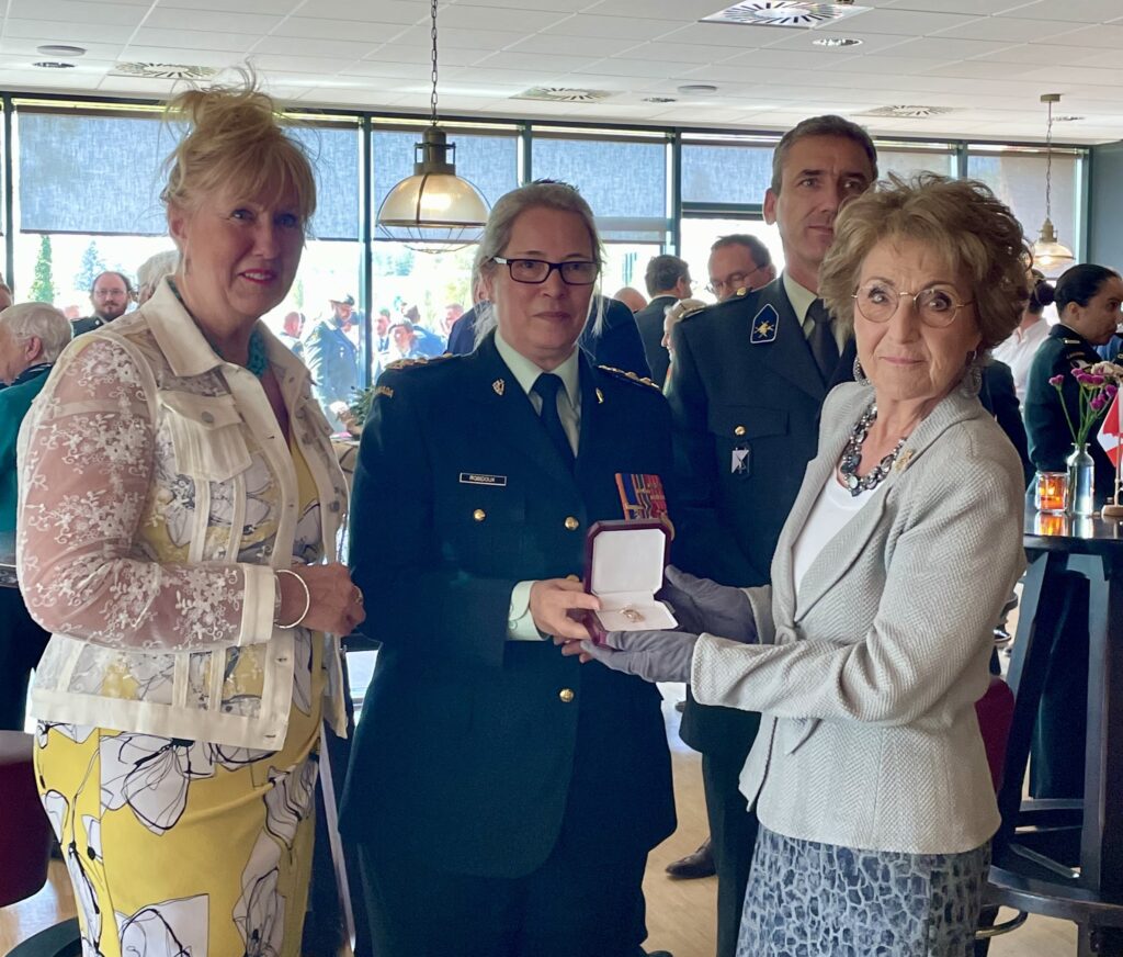 HRH Princess Margriet of The Netherlands is presented a C&E Branch Brooch by Colonel-Commandant Brigadier-General Josée Robidoux (Retired), Brooch was made by Theresa Merlo of Kingston (left)